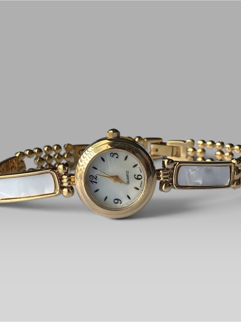 Avon Gold Tone Bracelet Watch with White Inlay
